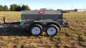 A trailer with two tires and a tank on it