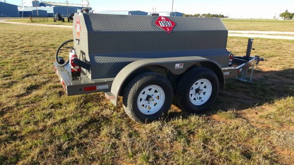 A gray trailer with a red sign on it