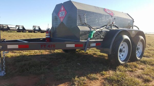 A gray trailer with a red and white star on it.