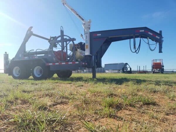 A crane is being used to lift a tractor.