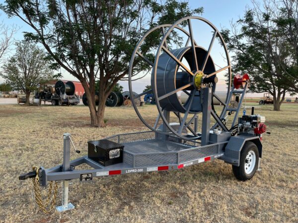 A large gray trailer with a big wheel on it