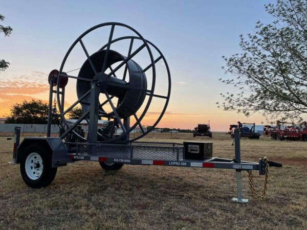 A large trailer with a hose attached to it.