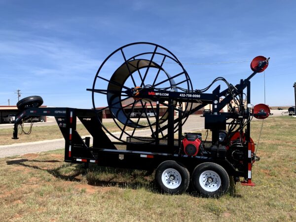 A large machine is parked in the grass.