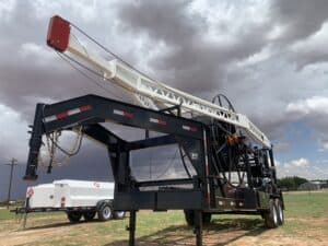 A large truck with a crane on it's back.