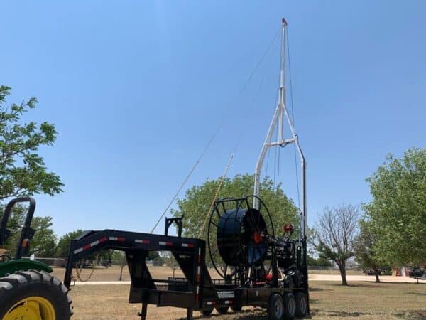 A large crane on the back of a truck.