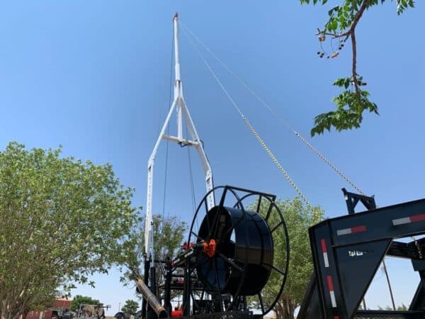 A crane that is attached to the side of a building.