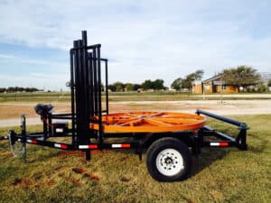 A trailer with an orange rack on it