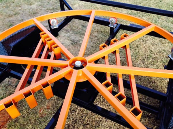 A close up of an orange and black wheel