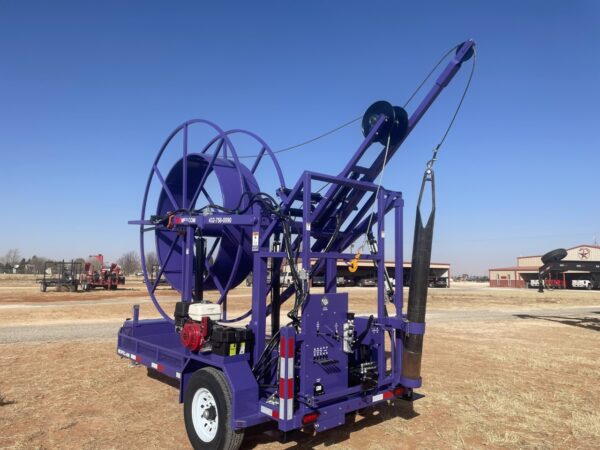 A purple trailer with a large hose attached to it.