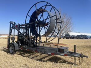 A large trailer with a large hose attached to it.