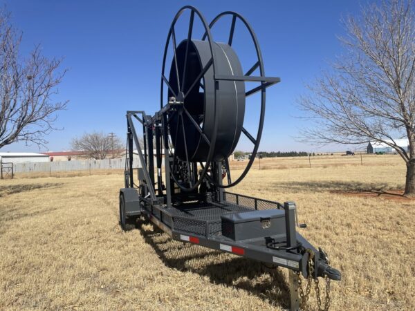 A large black hose attached to a trailer.