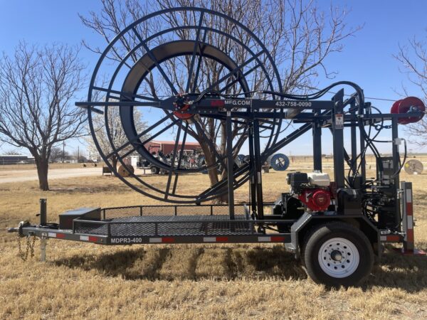 A large wheel trailer with a red and black engine.