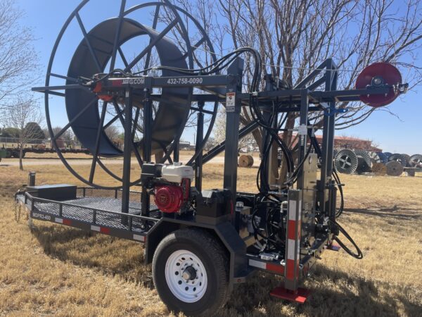 A trailer with a large hose attached to it.