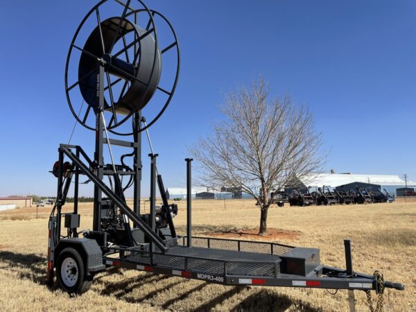 A large trailer with a large metal object on it.