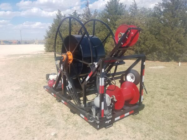 A large hose reel with fire hoses and other equipment.