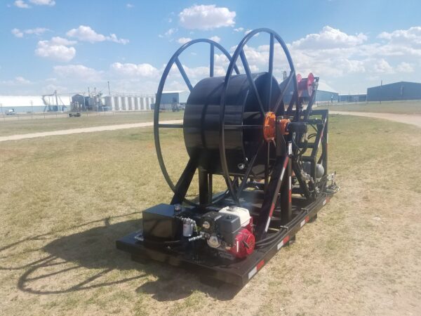 A large black hose connected to a metal cart.