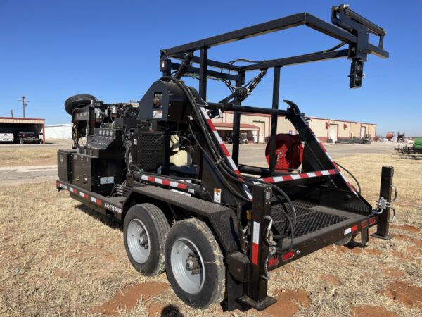 A large black truck with a crane on the back.