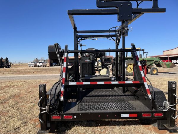 A trailer with a crane attached to it