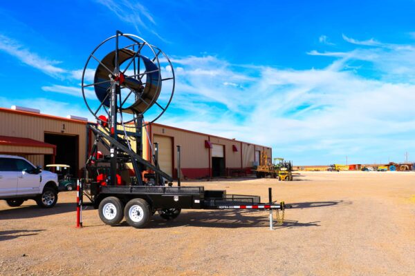 A trailer with a large fan attached to it.