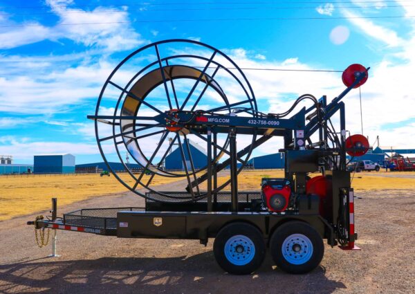 A large air boat on the road near some grass