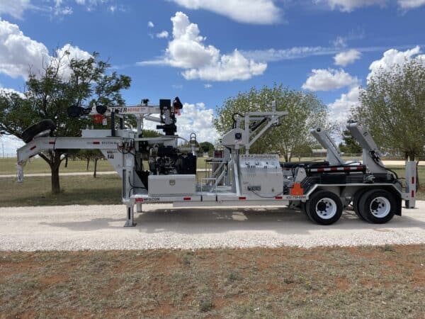 A large truck with a crane on the back.