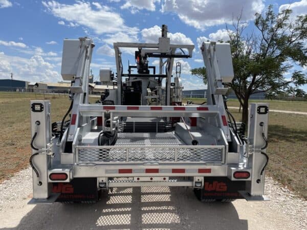 A large truck with two lift gates on the back.