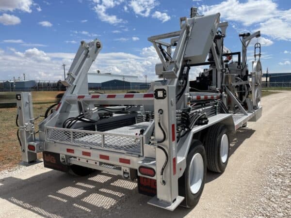 A large truck with a trailer attached to it