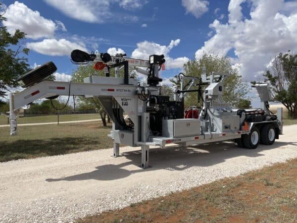 A large utility truck with a trailer attached to it.