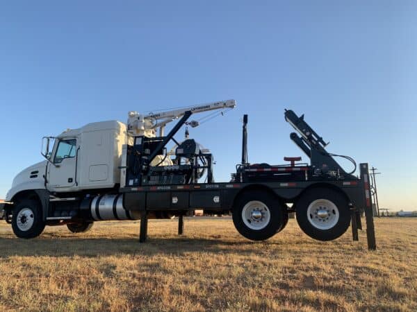 A large truck with a crane on the back of it.