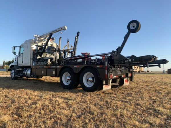 A large truck with a crane on the back of it.