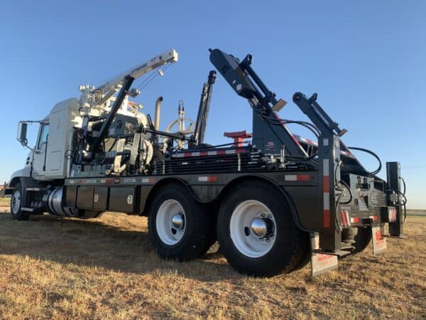 A large truck with a crane on the back