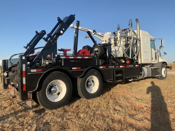 A large truck with a crane on the back of it.