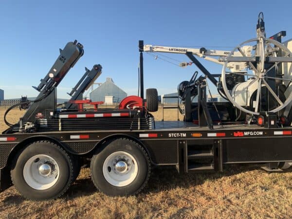 A truck with a crane on the back of it.