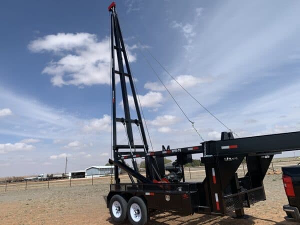 A large crane on the back of a trailer.