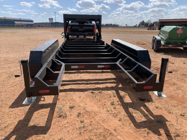 A large trailer with two long sections attached to it.