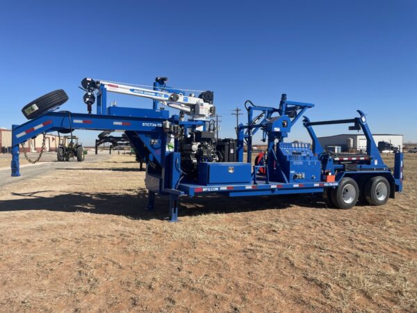 A blue trailer with a crane on the back