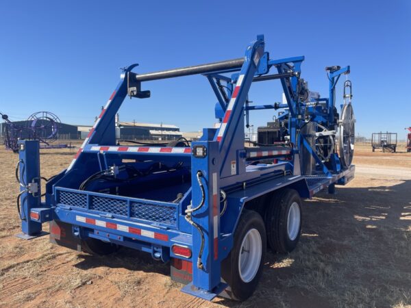 A blue truck with a crane on the back