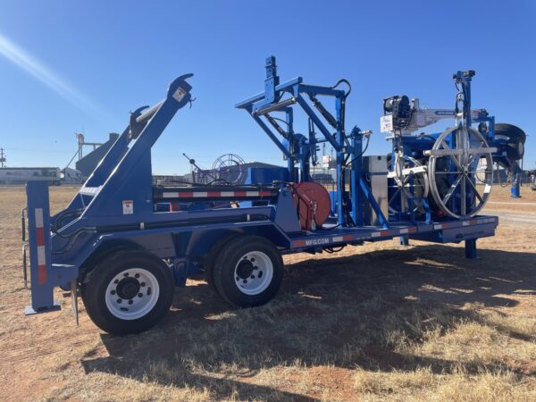 A blue trailer with a crane on the back