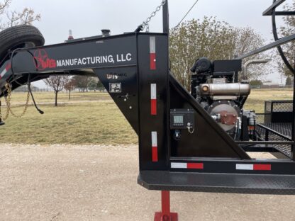 A black truck with a red pole on the side.