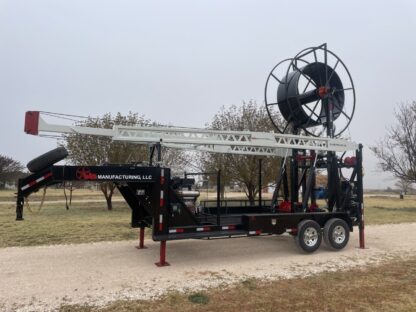 A large trailer mounted water well drilling rig.