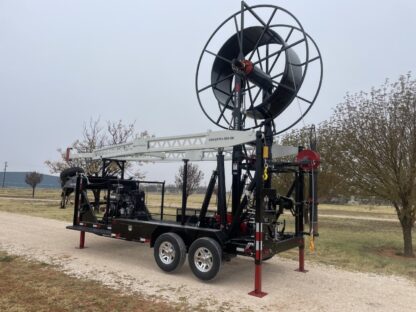 A large trailer with a windmill attached to it.