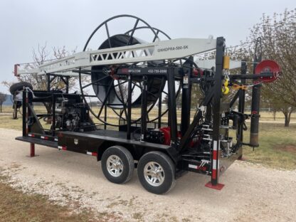 A large trailer with a crane attached to it.