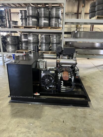 A large machine in a warehouse with many metal containers.