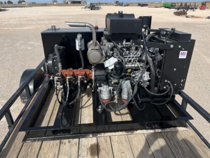 A truck with several engines on it's trailer.