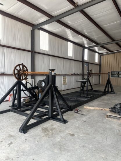 A large machine in an industrial setting with white walls.