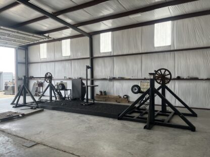 A gym with many machines in it