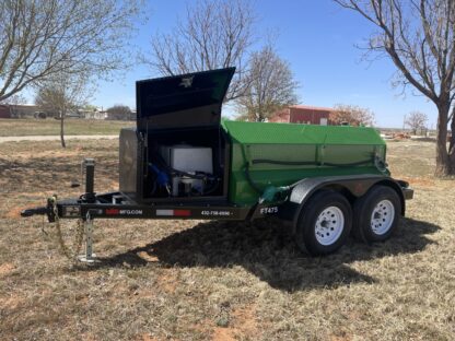 A green trailer with a black door and a television on the back.