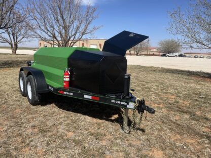 A green and black trailer with an open door.