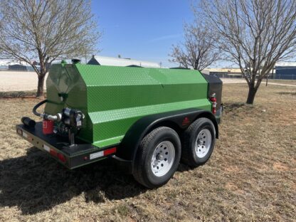 A green trailer with two tanks on it