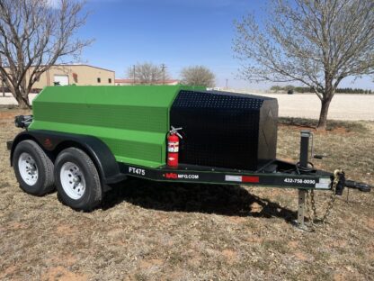 A green trailer with a black box on it